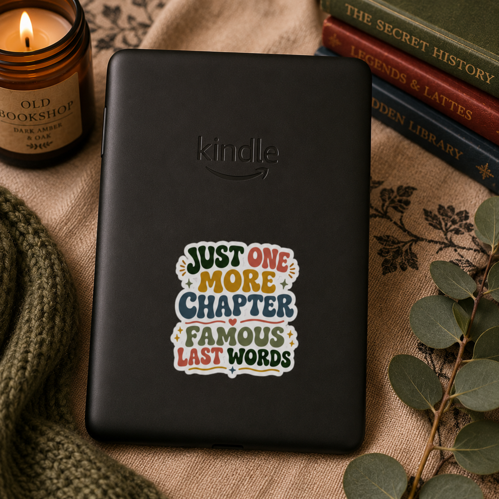 “Just One More Chapter. Famous Last Words” sticker with green, coral, gold, and blue retro lettering with hearts and sparkles, shown on a black Kindle.