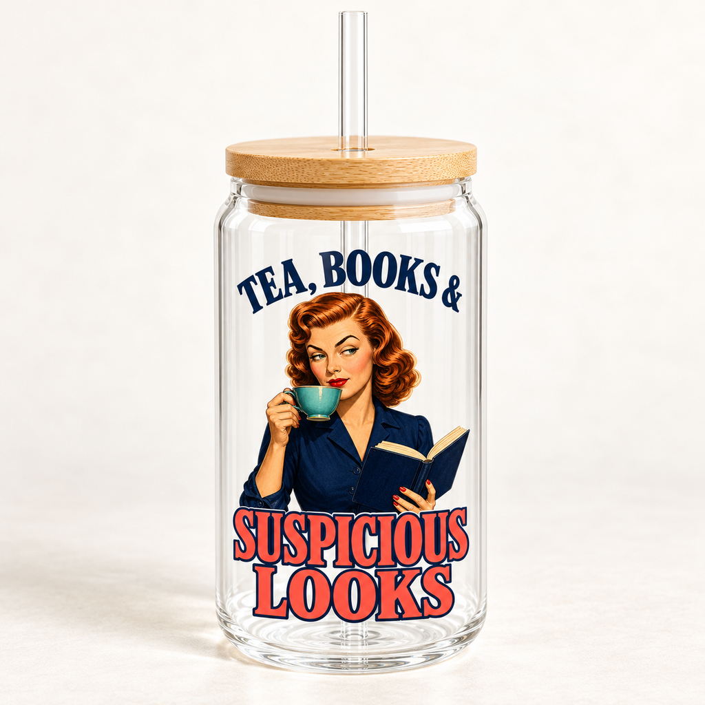 Front view of an empty glass sipper with bamboo lid and clear straw; a red-haired woman holds a teal teacup and navy book beneath “Tea, Books & Suspicious Looks” lettering.