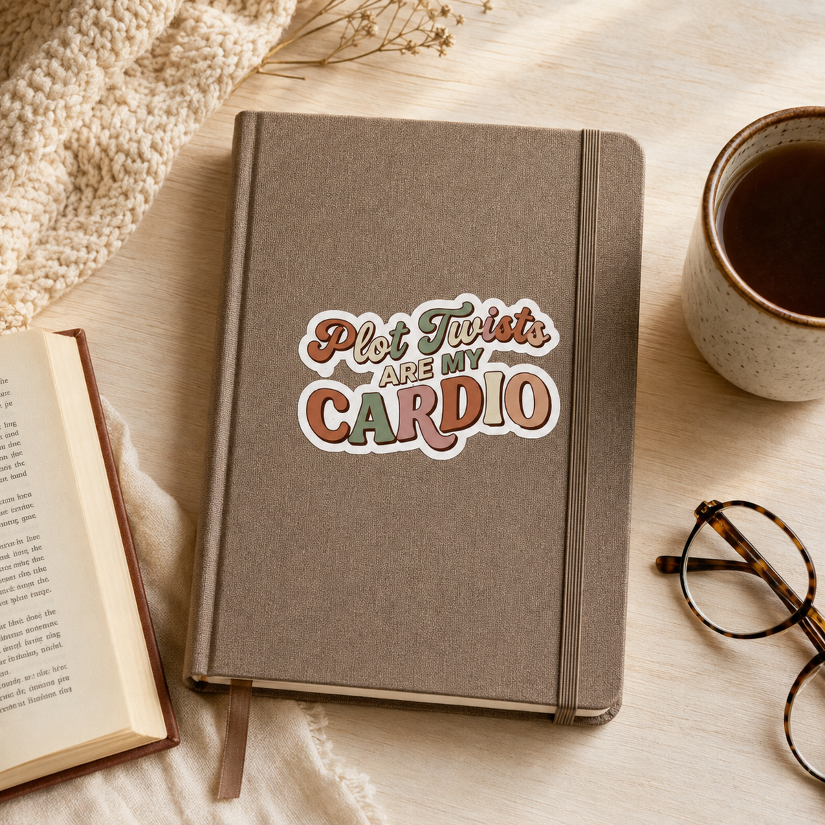 “Plot Twists Are My Cardio” sticker with rust, sage, and peach retro lettering, shown on a taupe journal.
