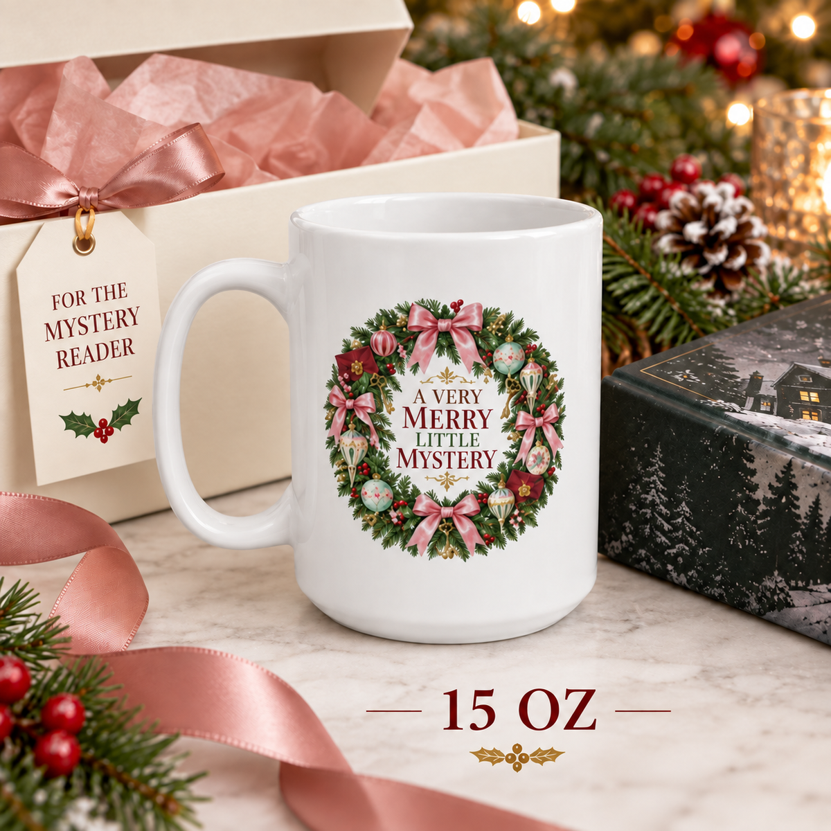15-ounce “A Very Merry Little Mystery” mug beside an open gift box with pink tissue, a mystery-reader gift tag, evergreen branches and a black winter village box.