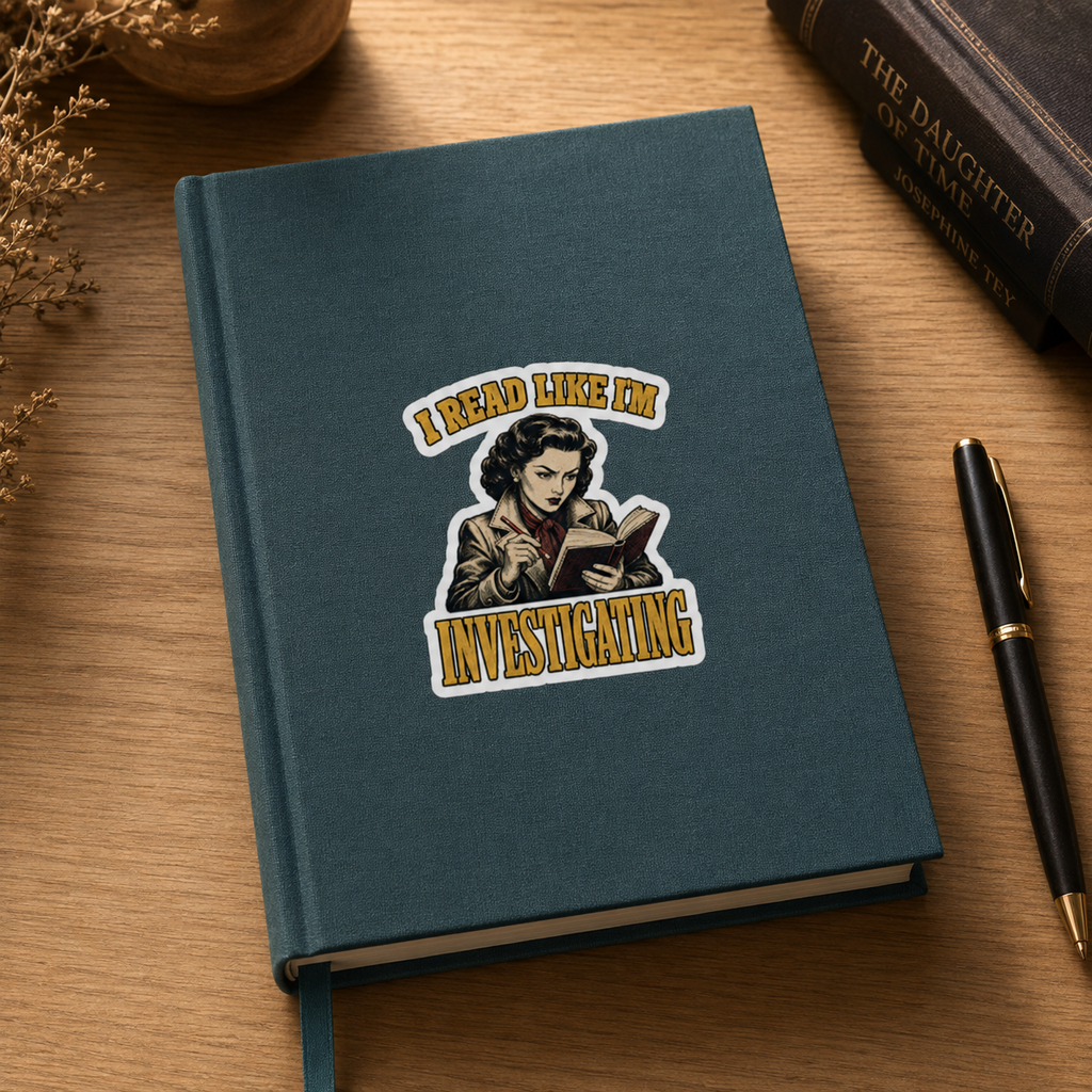 “I Read Like I’m Investigating” sticker with a retro reader taking notes while reading, framed by gold lettering, shown on a teal journal.